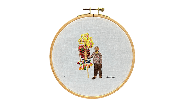 インドの装飾を売る男性の刺繍
