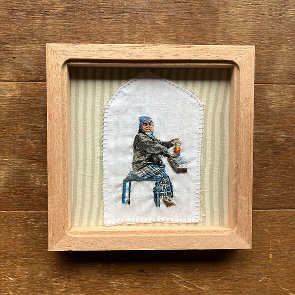 インドの男性の刺繍-